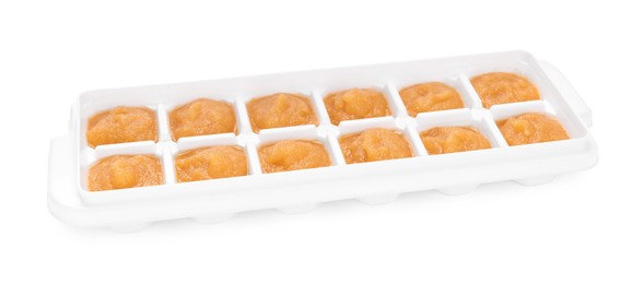 Photo of Nectarine puree in ice cube tray isolated on white. Ready for freezing
