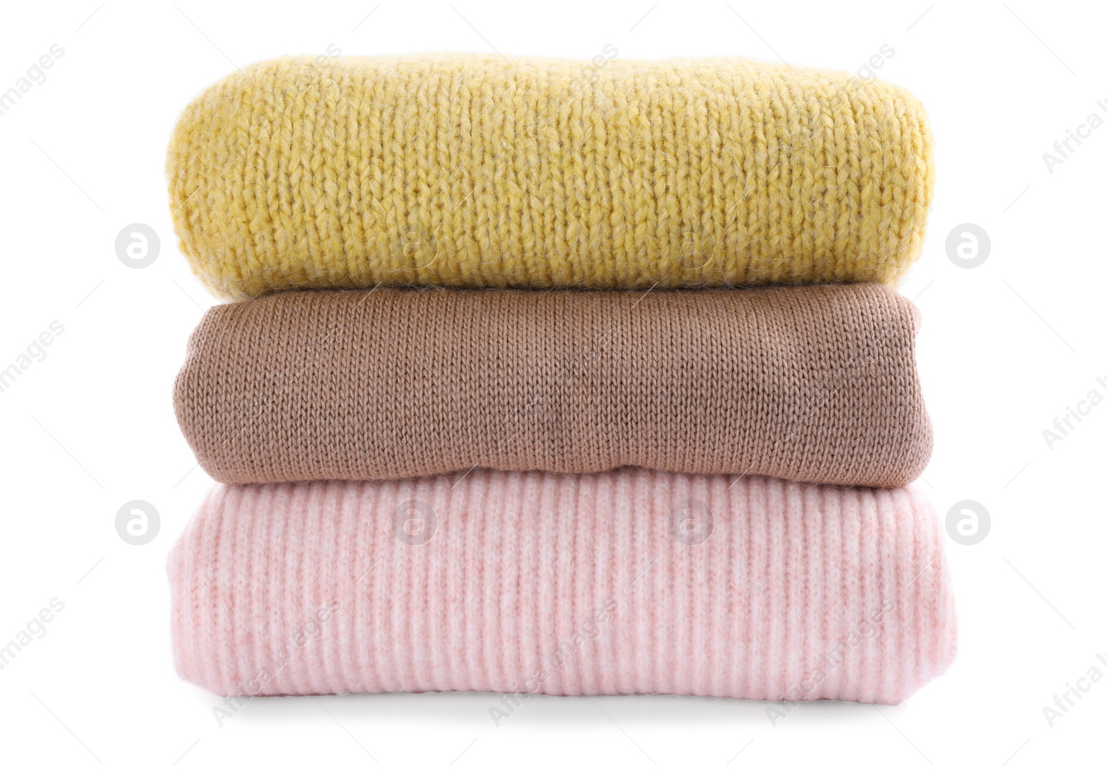 Photo of Stack of warm sweaters isolated on white