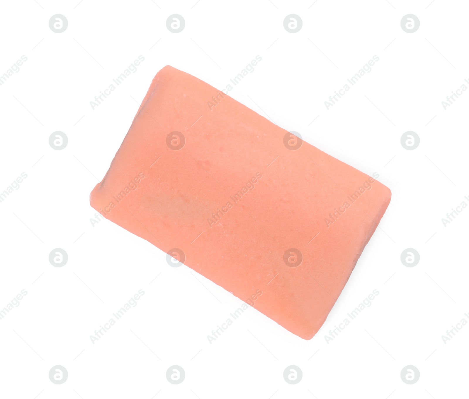 Photo of Orange chewy candy with liquorice isolated on white, top view