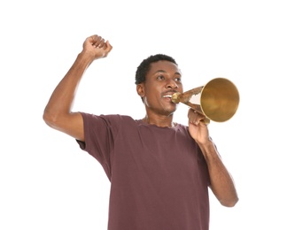 Photo of Young African-American man shouting into megaphone on white background