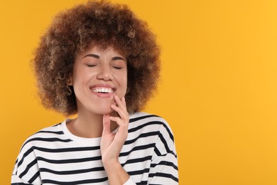 Photo of Woman with clean teeth smiling on yellow background, space for text