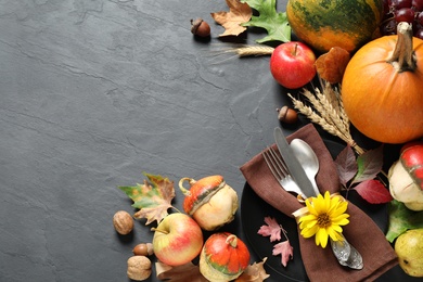 Autumn fruits, vegetables and cutlery on grey background, space for text. Happy Thanksgiving day