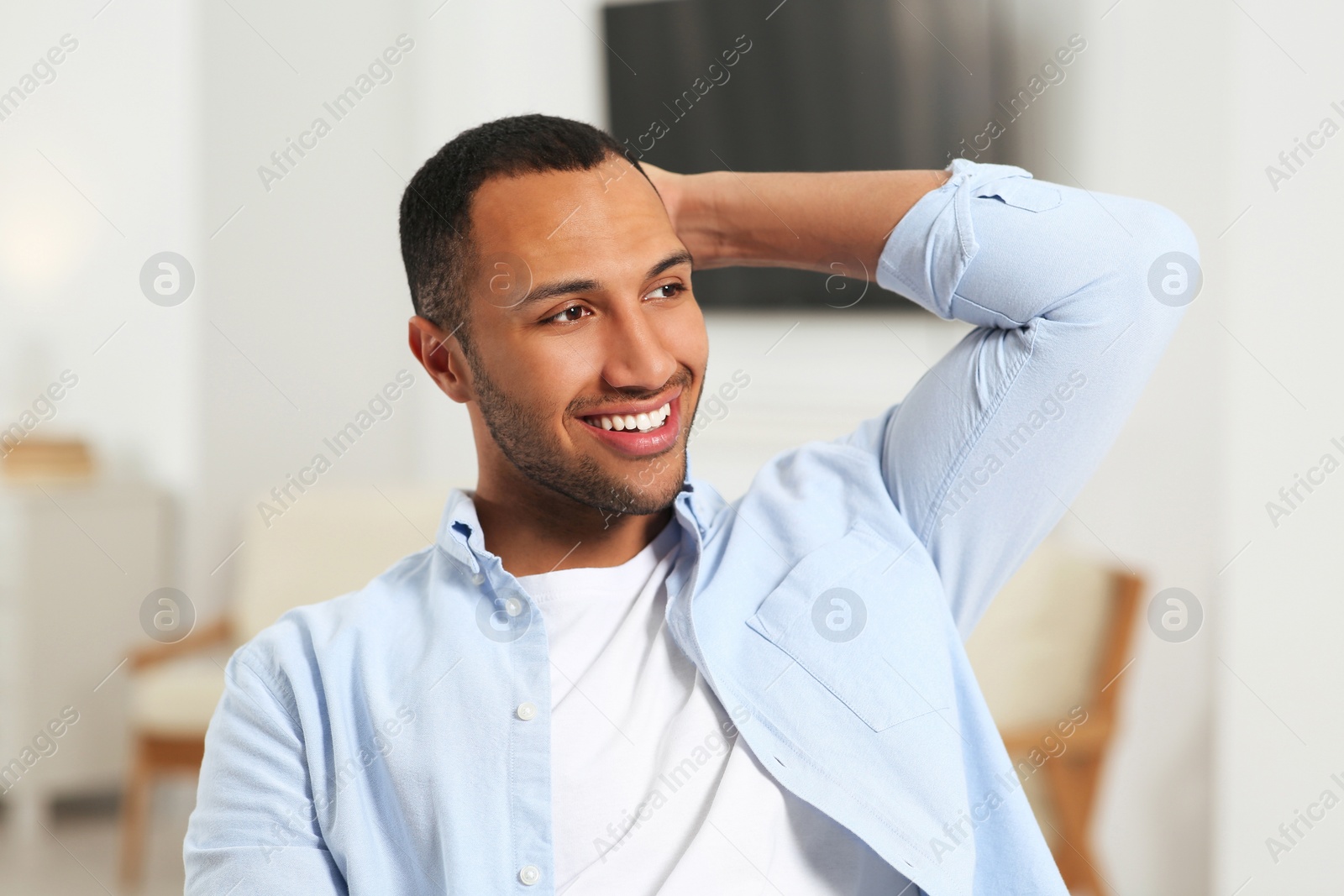 Photo of Portrait of smiling African American man at home