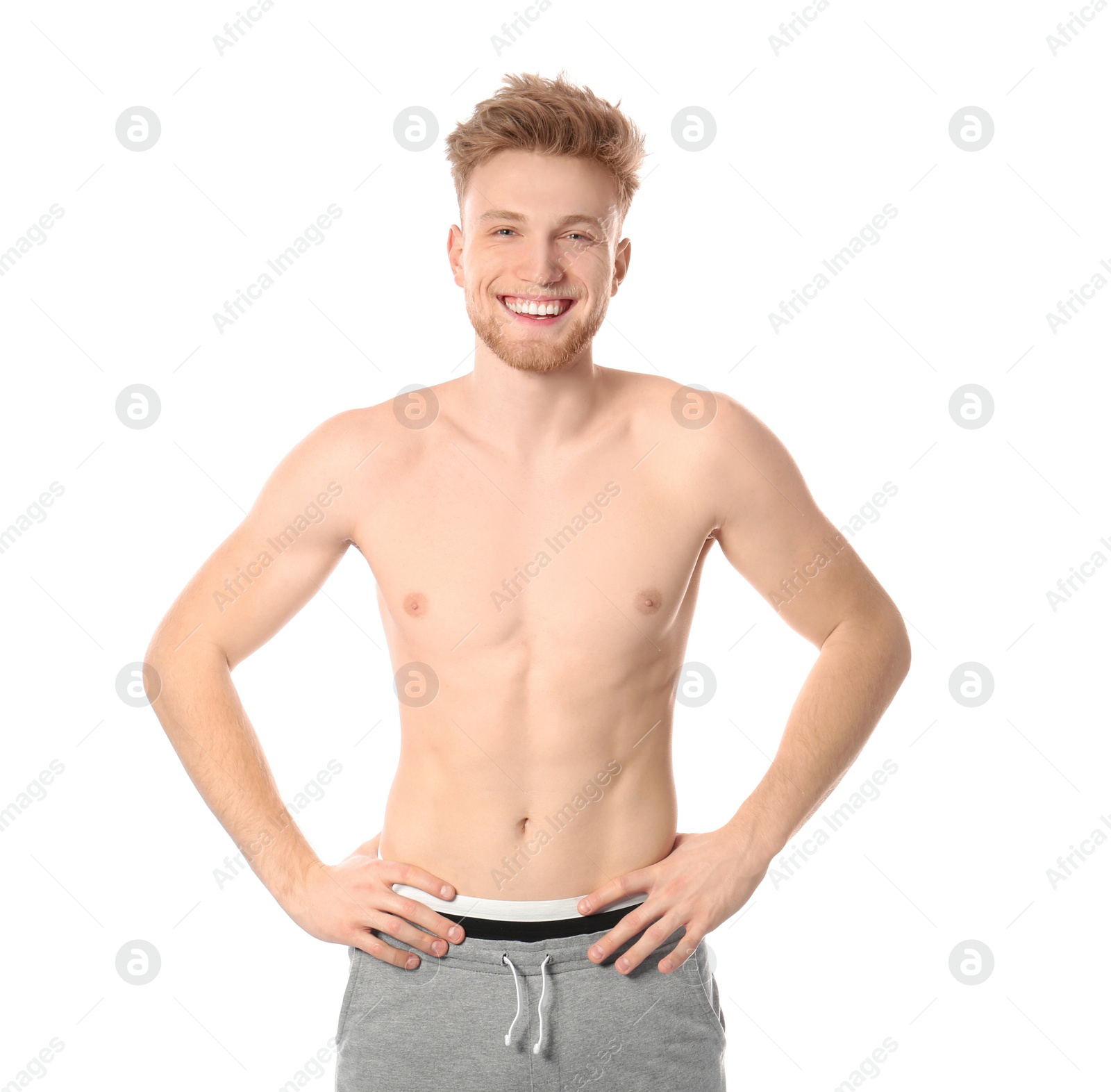 Photo of Portrait of young man with slim body on white background