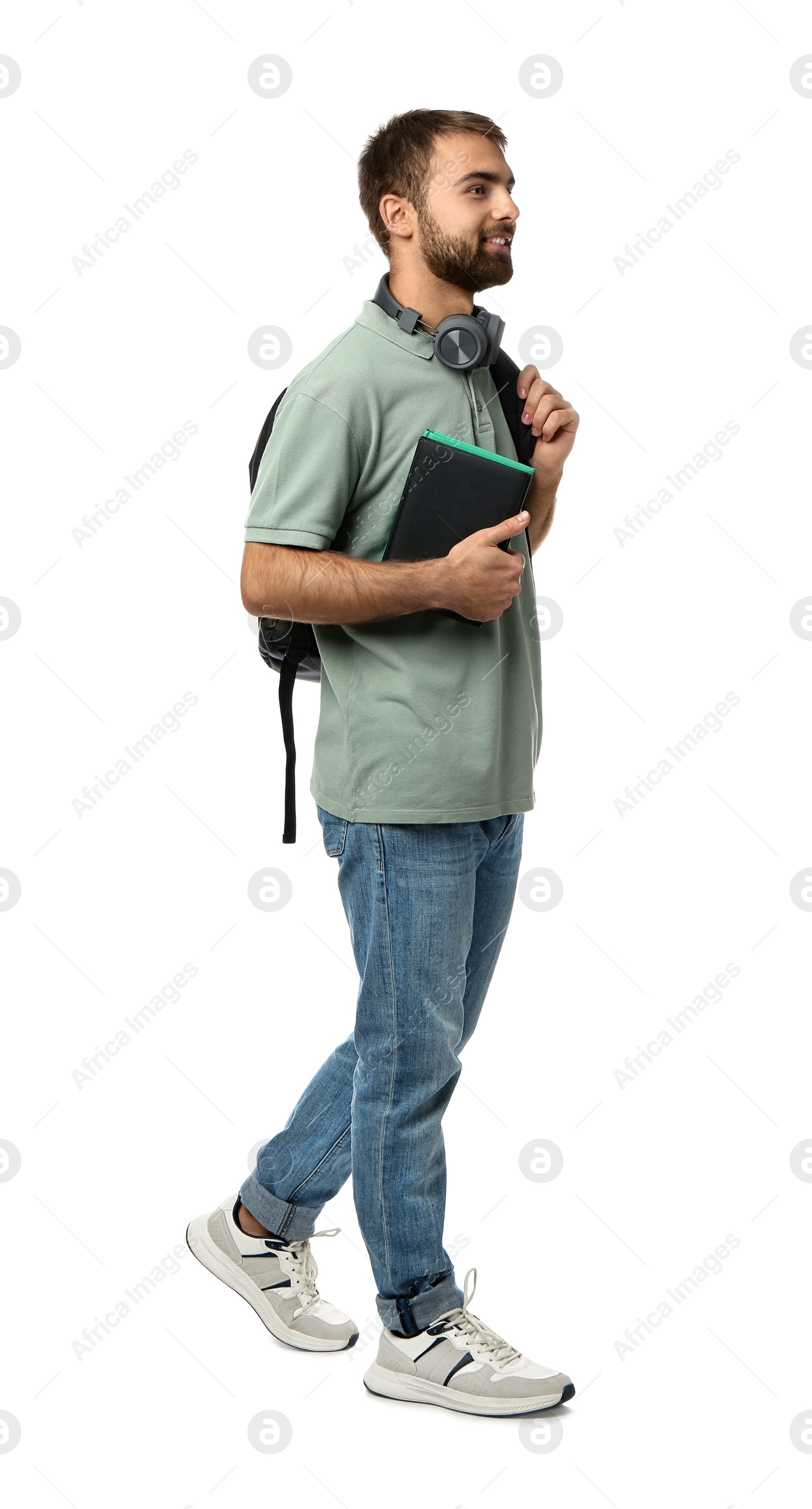 Photo of Student with headphones, backpack and books on white background