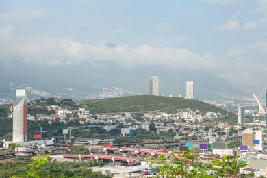 Photo of Picturesque view of beautiful cityscape under fog