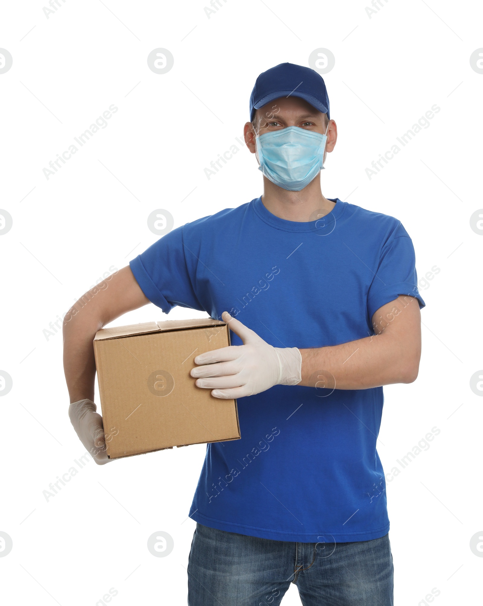 Photo of Courier in protective mask and gloves holding cardboard box on white background. Delivery service during coronavirus quarantine