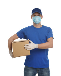 Photo of Courier in protective mask and gloves holding cardboard box on white background. Delivery service during coronavirus quarantine