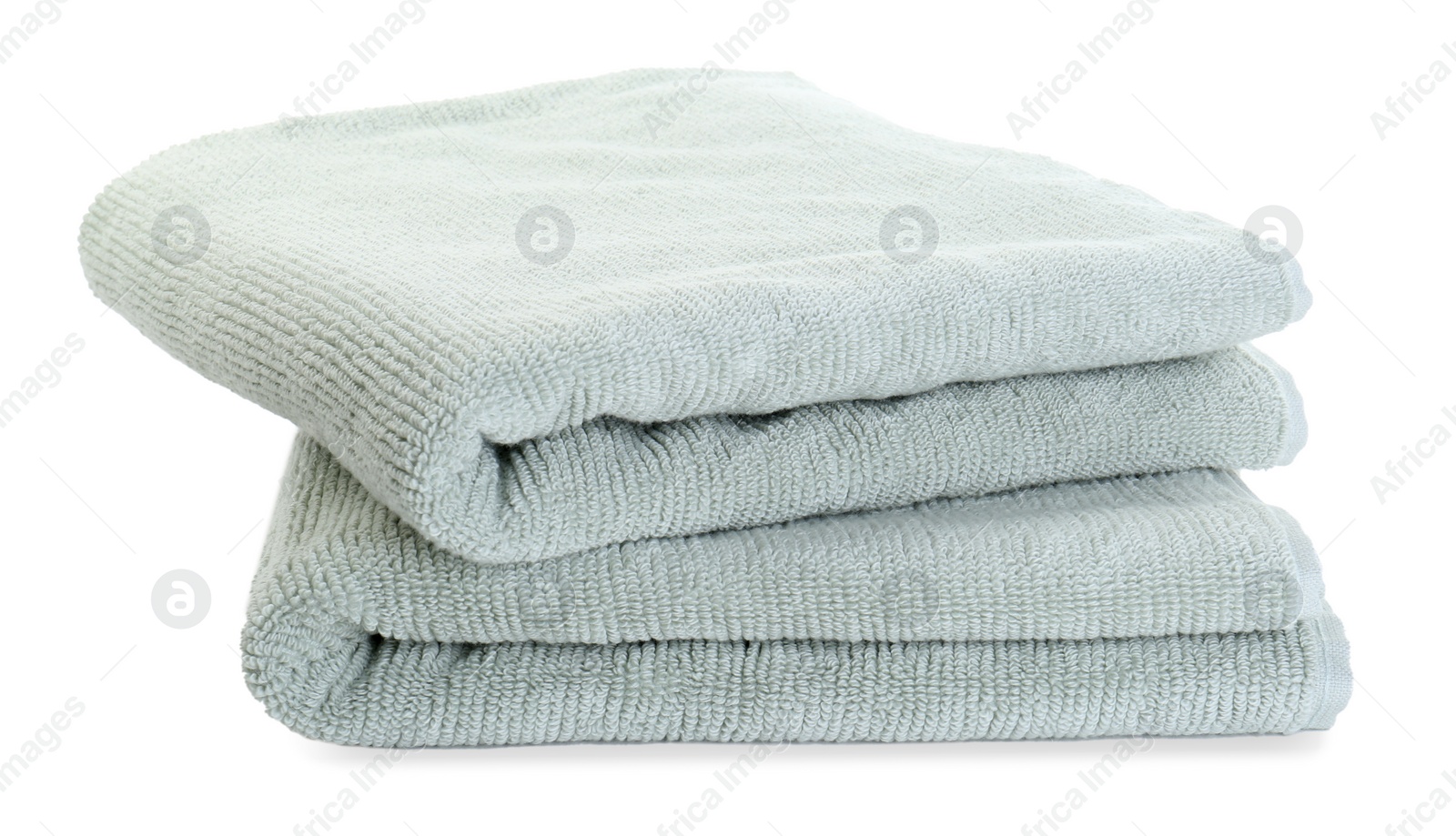 Photo of Soft folded terry towels isolated on white