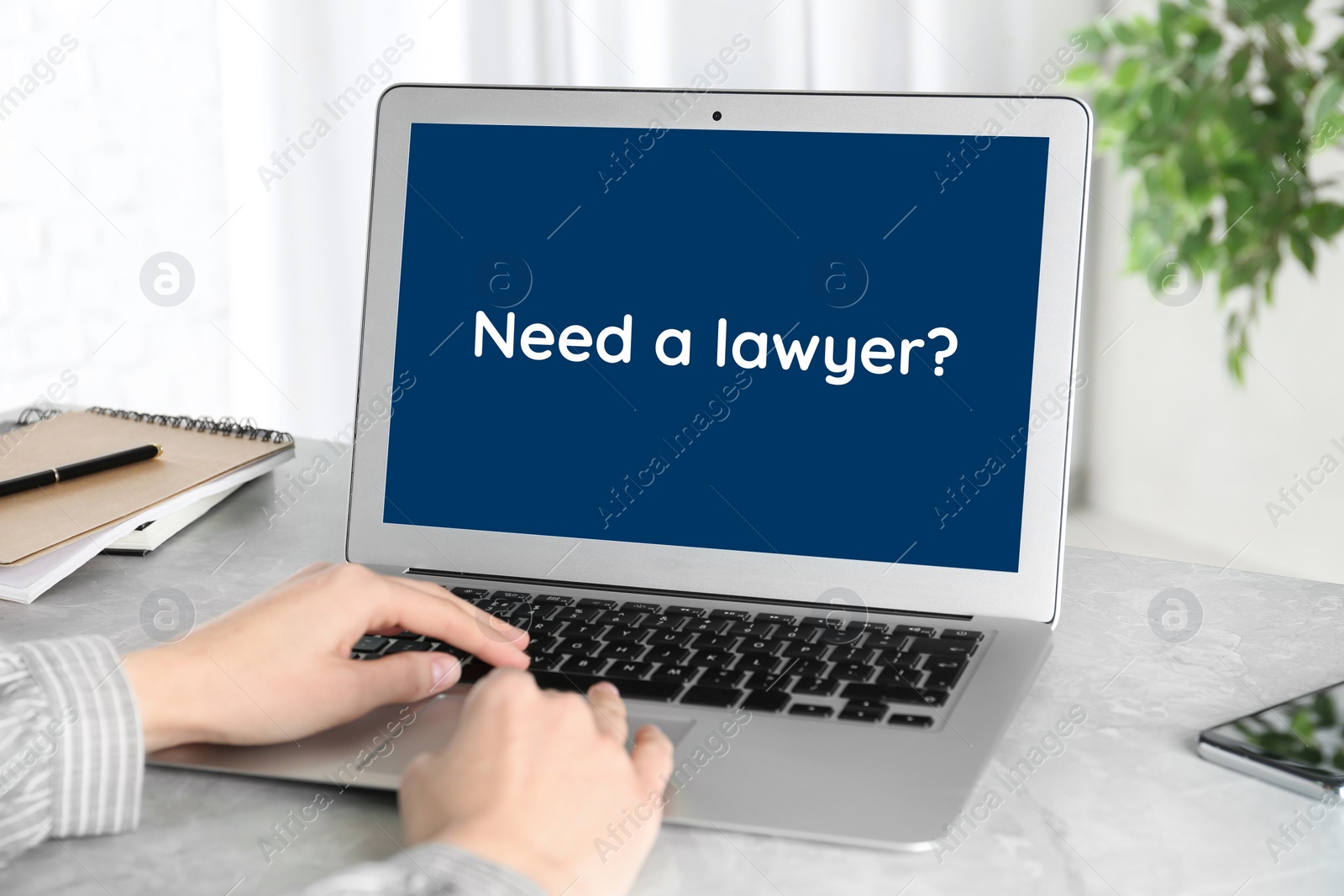 Image of Woman using laptop at desk indoors, closeup. Need a lawyer?