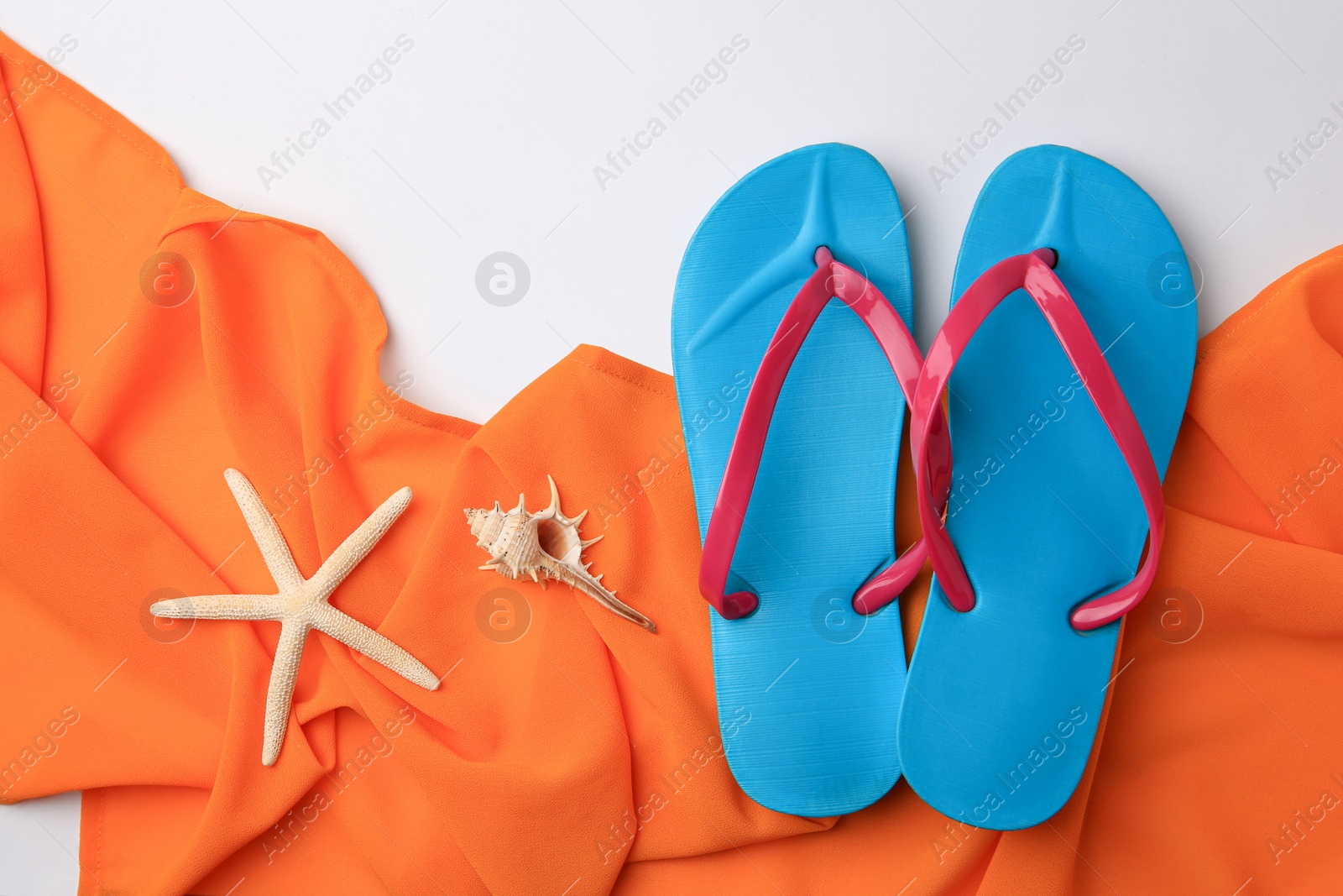 Photo of Flat lay composition with beach accessories on white background