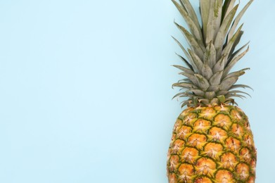Photo of Delicious ripe pineapple on white background, top view. Space for text