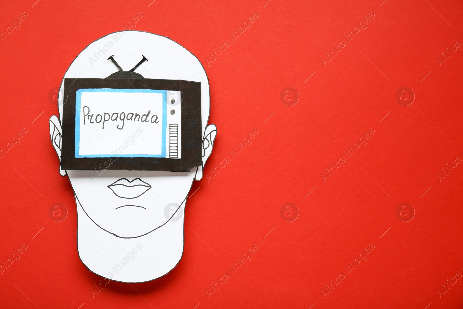 Photo of Information warfare concept. Human blinded with propaganda in media field. Paper cutouts on red background, top view and space for text