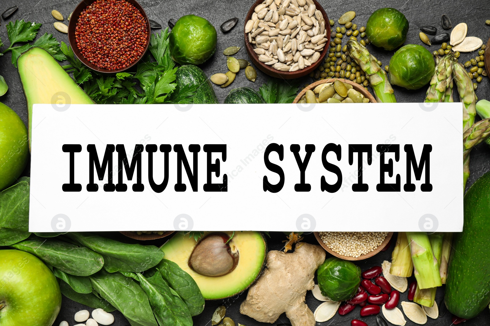 Image of Immune system boosting with proper nutrition. Different foods on black table, flat lay