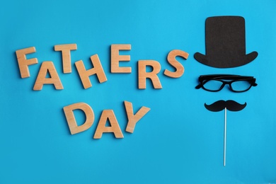 Flat lay composition with paper decor and glasses on color background. Happy Father's Day