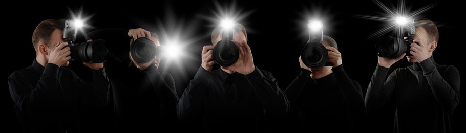 Group of photographers with cameras on black background, banner design. Paparazzi taking pictures with flashes