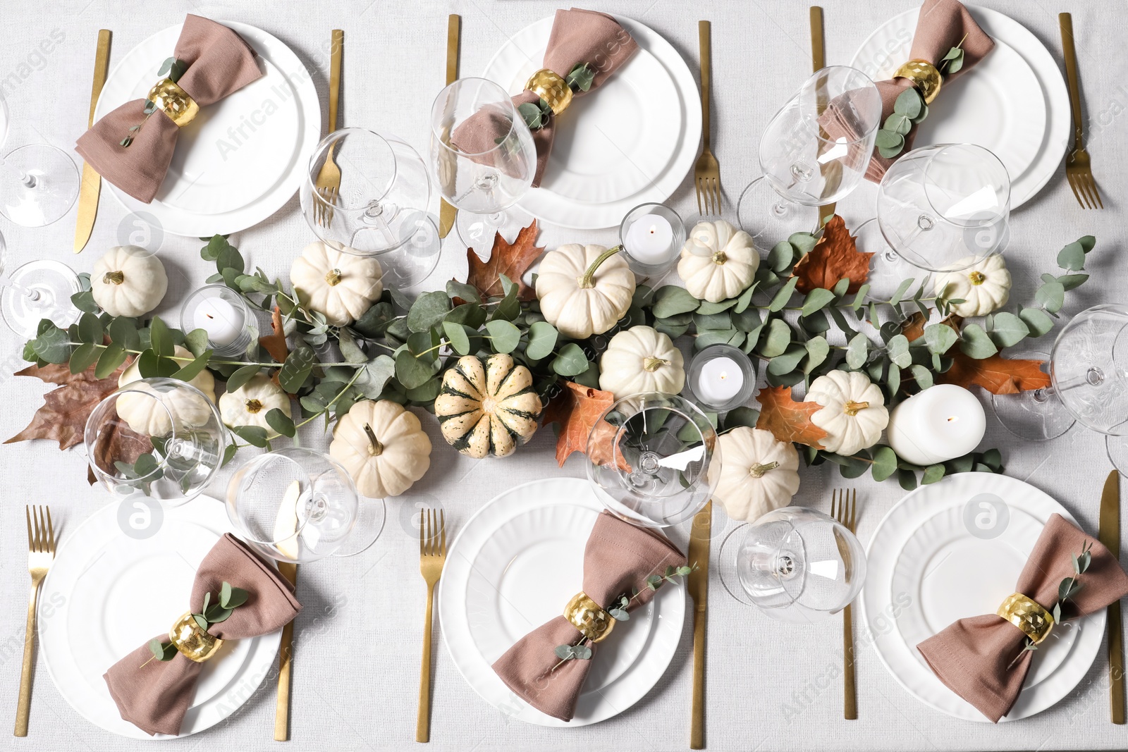 Photo of Beautiful autumn table setting. Plates, cutlery, glasses, pumpkins and floral decor, flat lay