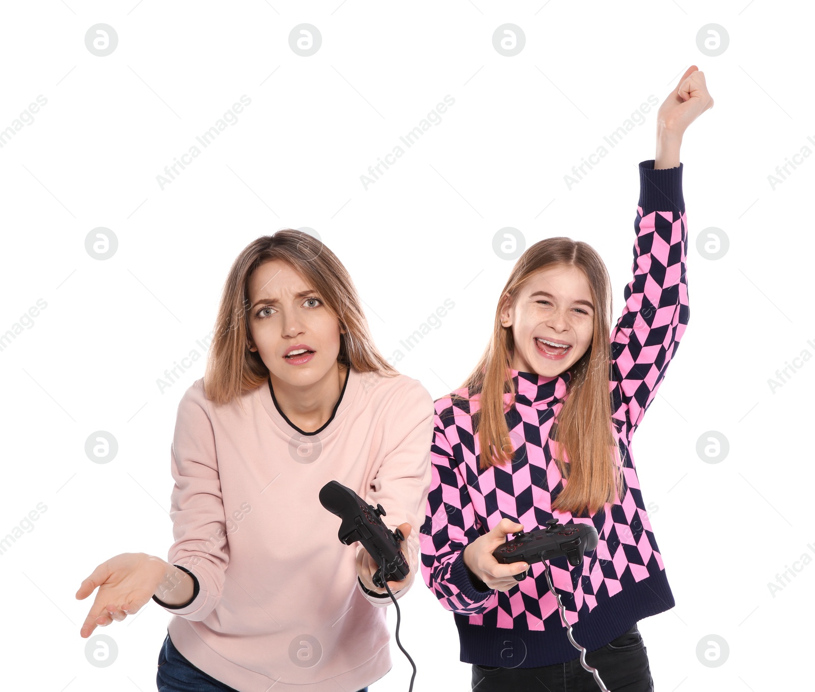 Photo of Young woman and teenage girl playing video games with controllers isolated on white