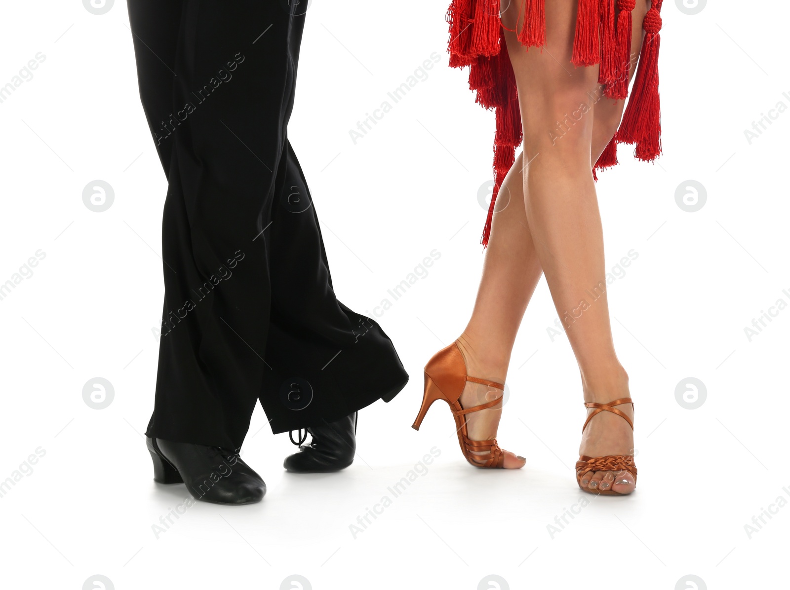 Photo of Young couple dancing on white background, closeup of legs