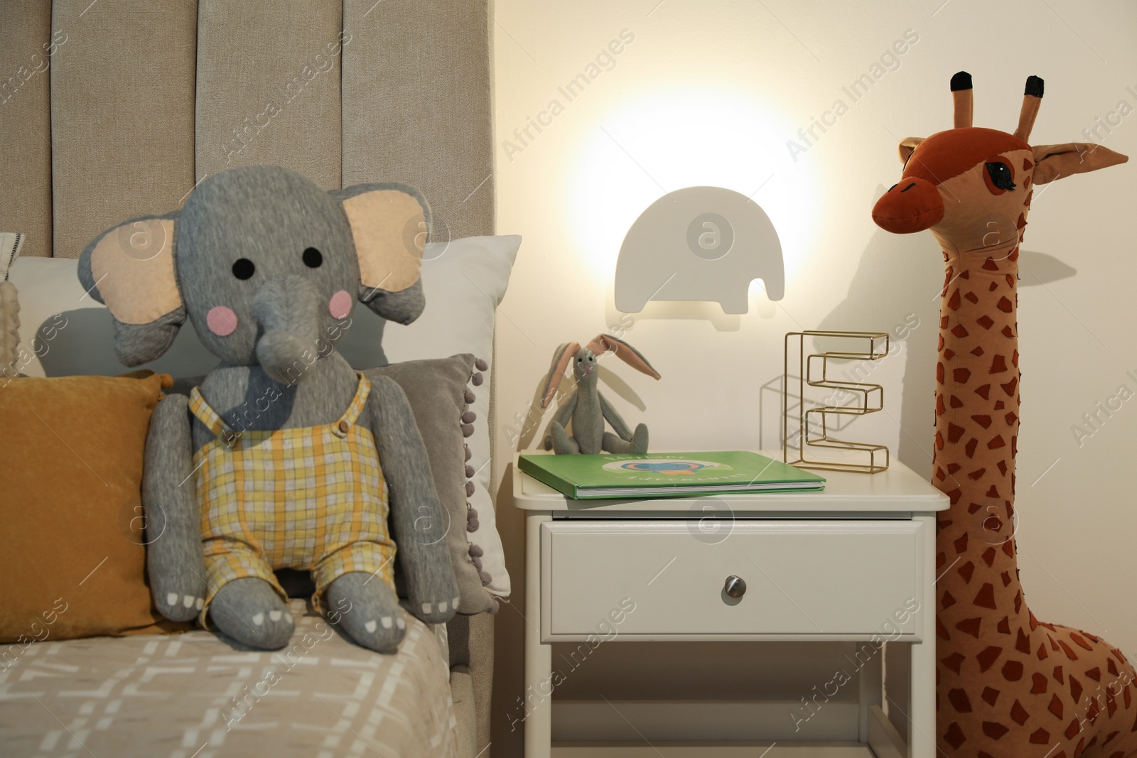 Photo of Animal shaped night lamp on wall in child's room