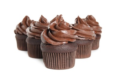 Delicious chocolate cupcakes with cream on white background