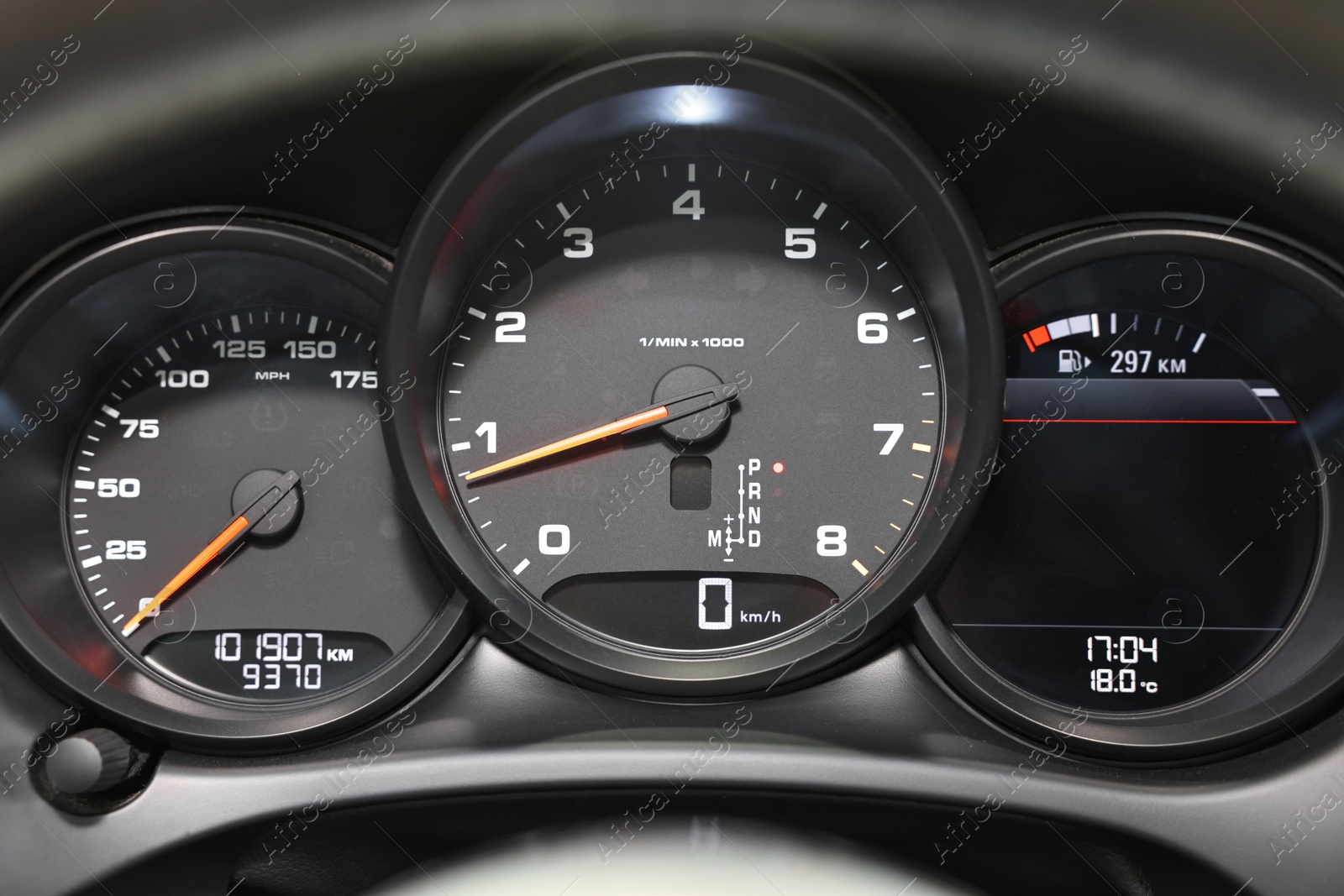 Photo of Speedometer and tachometer inside of modern car, closeup