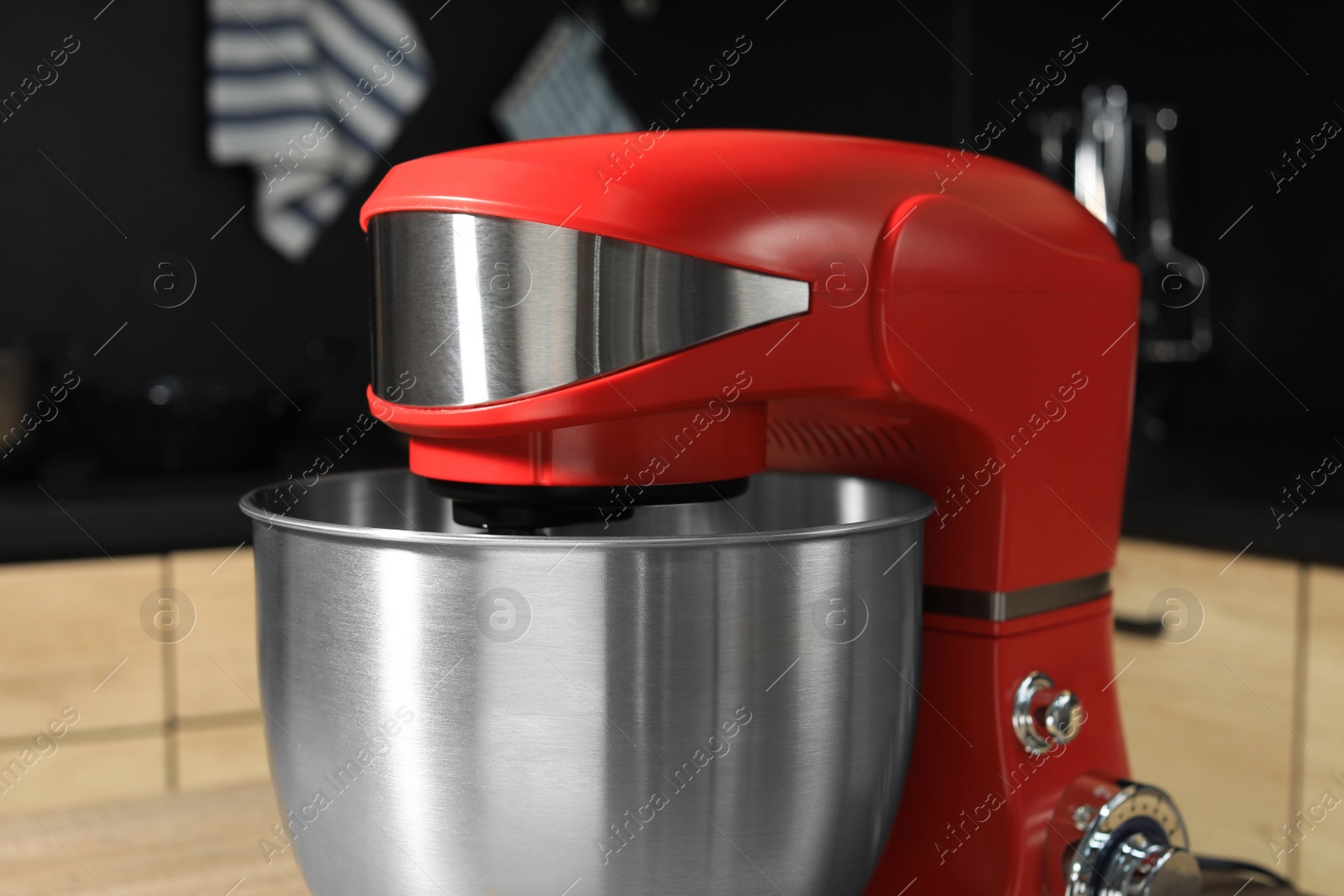 Photo of Modern stand mixer on table in kitchen, closeup