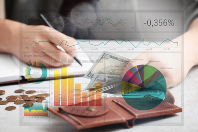 Image of Forex trading. Man with money at table and charts, closeup