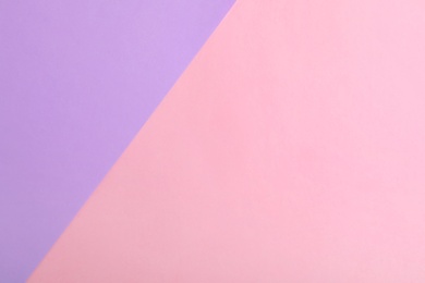 Photo of Violet and pink paper sheets as colorful background, top view