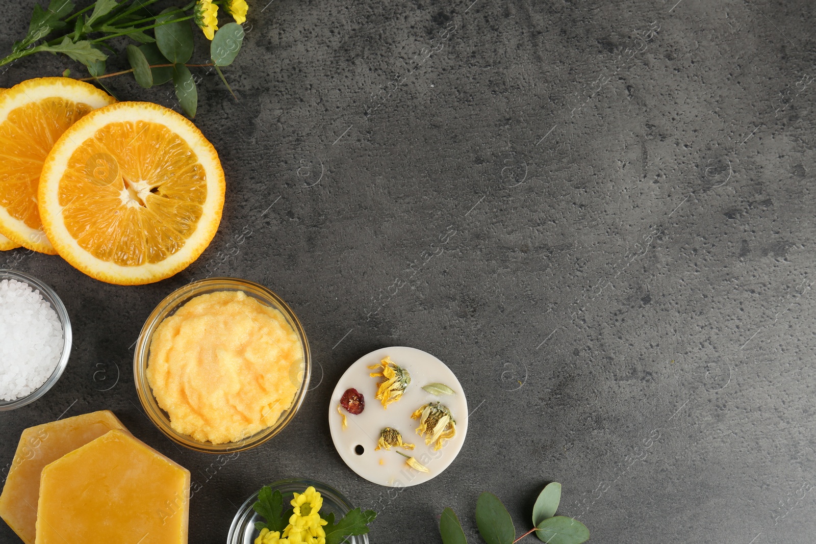 Photo of Homemade cosmetic products and fresh ingredients on black table, flat lay. Space for text