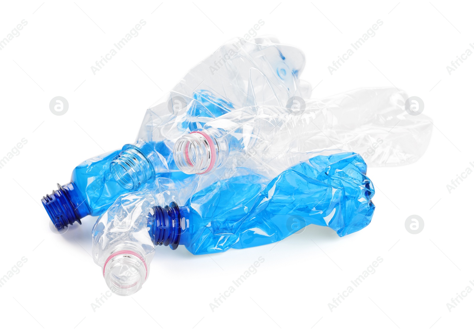 Photo of Crumpled disposable plastic bottles on white background