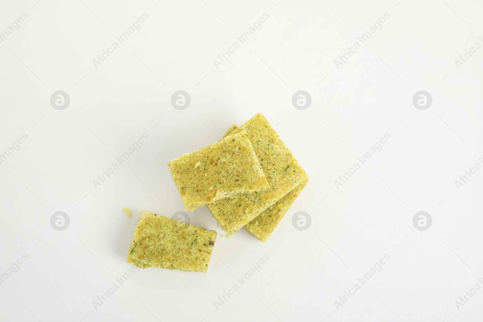 Photo of Bouillon cubes on white background, top view