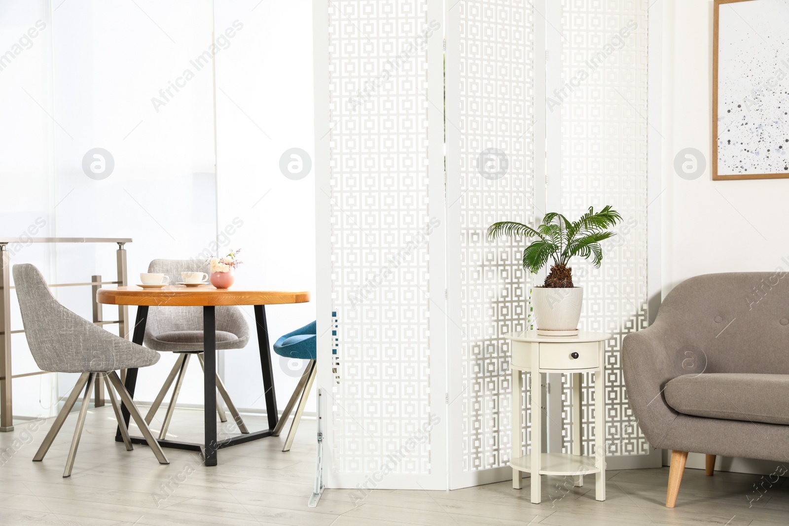 Photo of Modern folding screen in stylish room interior