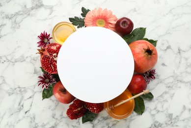 Photo of Flat lay composition with Rosh Hashanah holiday attributes and card on white marble table. Space for text
