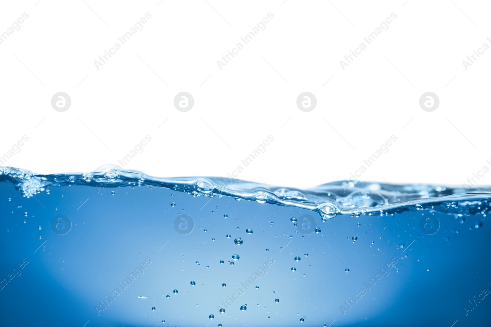 Photo of Bubbles in blue water on white background