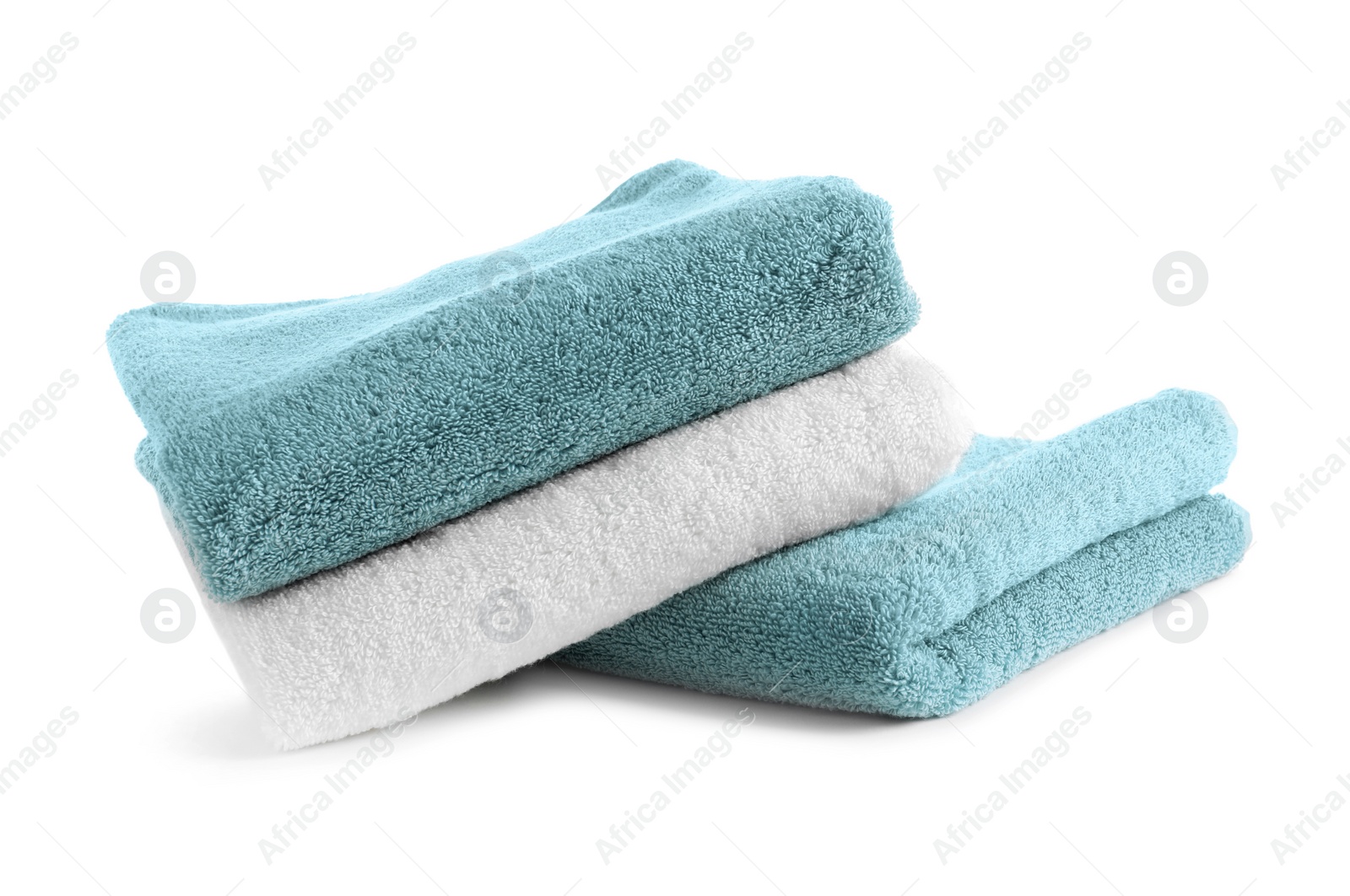 Photo of Stack of clean soft towels on white background