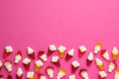 Tasty jelly candies in shape of ice cream on pink background, flat lay. Space for text