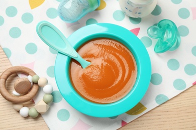 Photo of Flat lay composition with healthy baby food on wooden table