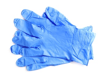 Photo of Pair of medical gloves isolated on white, top view