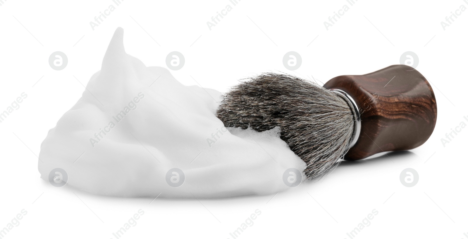 Photo of Shaving foam and brush on white background