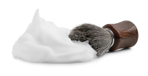 Shaving foam and brush on white background