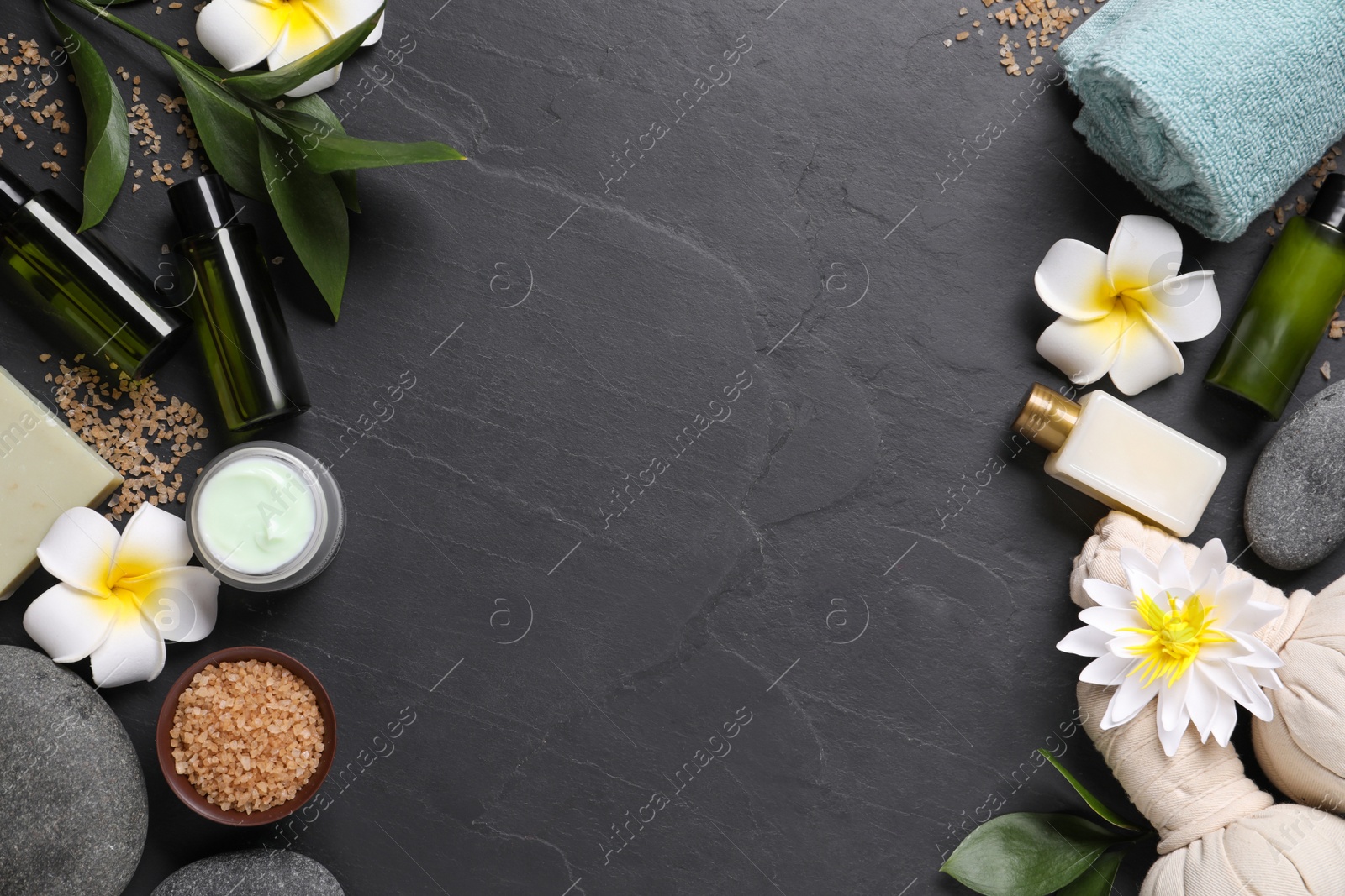Photo of Flat lay composition with spa accessories on black background. Space for text
