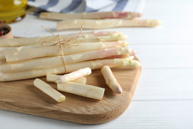 Fresh white asparagus on wooden table, closeup