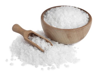 Natural sea salt, wooden bowl and scoop on white background