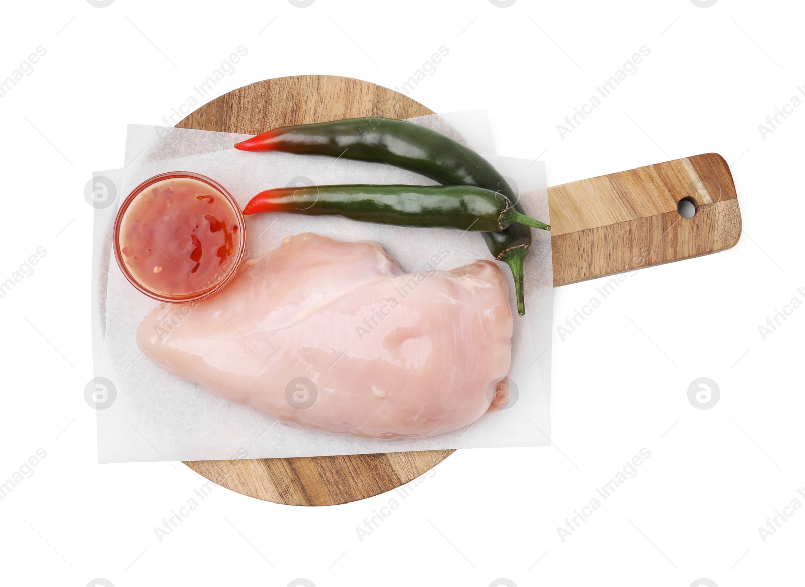 Photo of Marinade, basting brush, raw chicken fillets and chili peppers isolated on white, top view