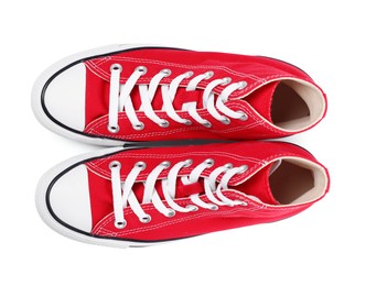 Photo of Pair of new red stylish plimsolls on white background, top view