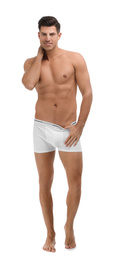 Handsome man in underwear on white background