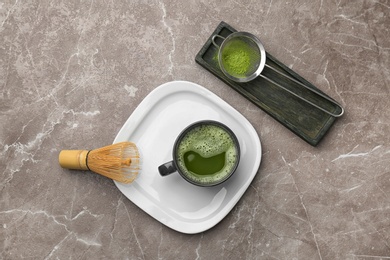 Flat lay composition with matcha tea on table