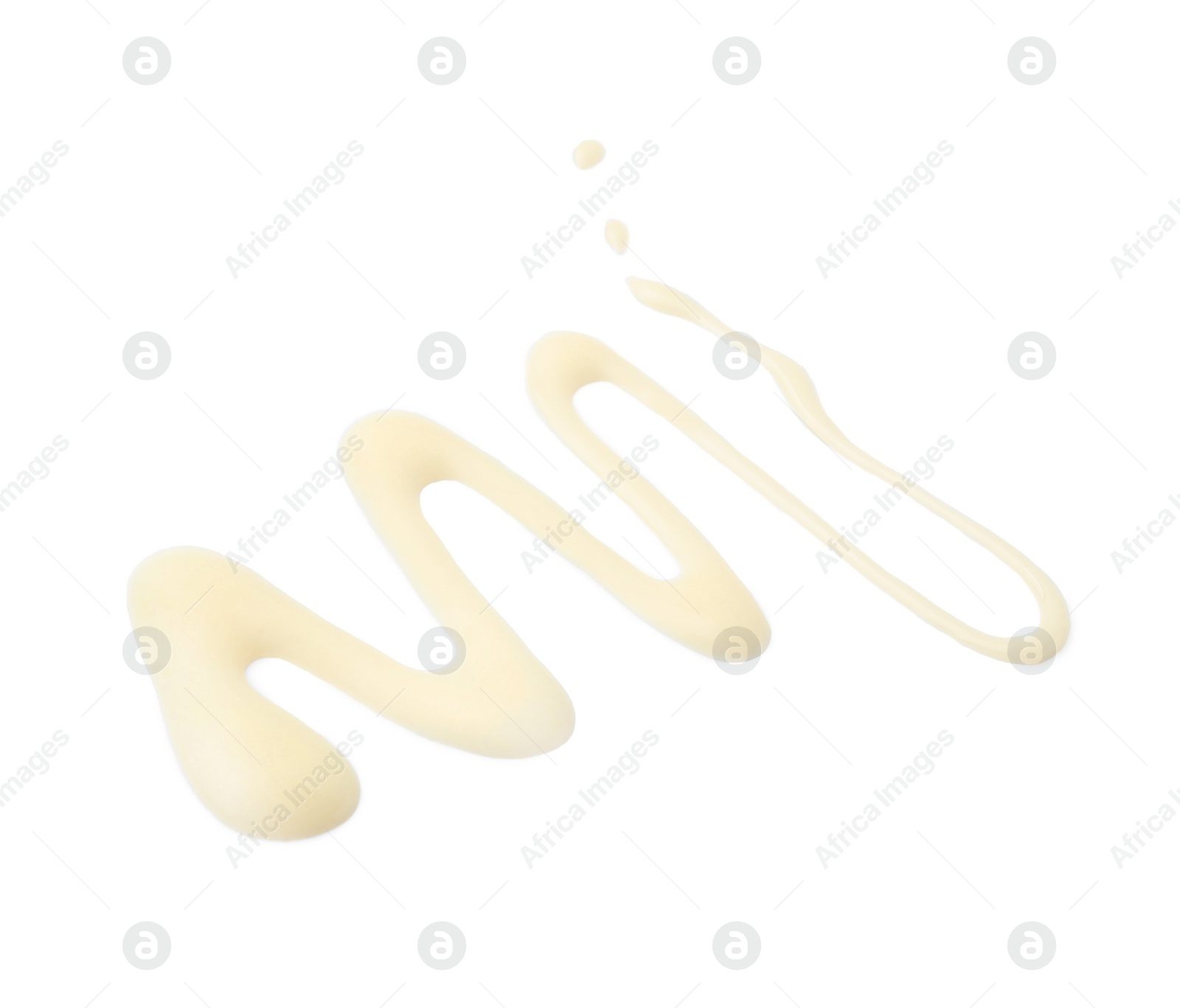 Photo of Spilled tasty condensed milk isolated on white