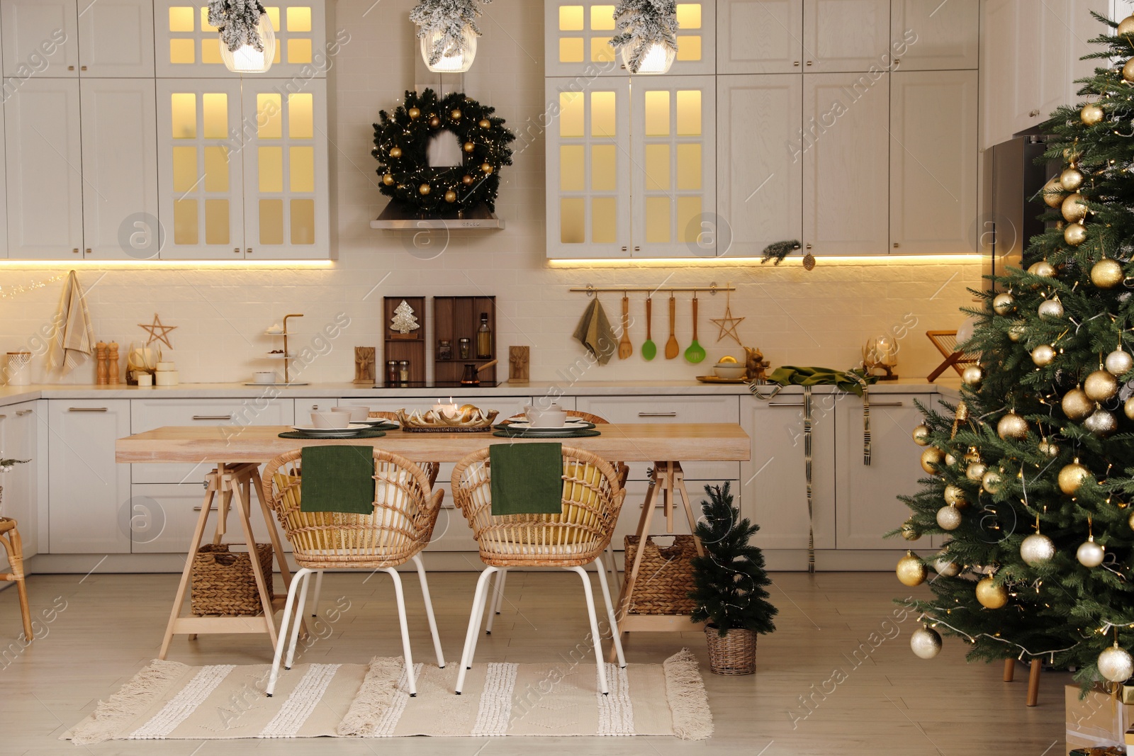 Photo of Cozy spacious kitchen decorated for Christmas. Interior design